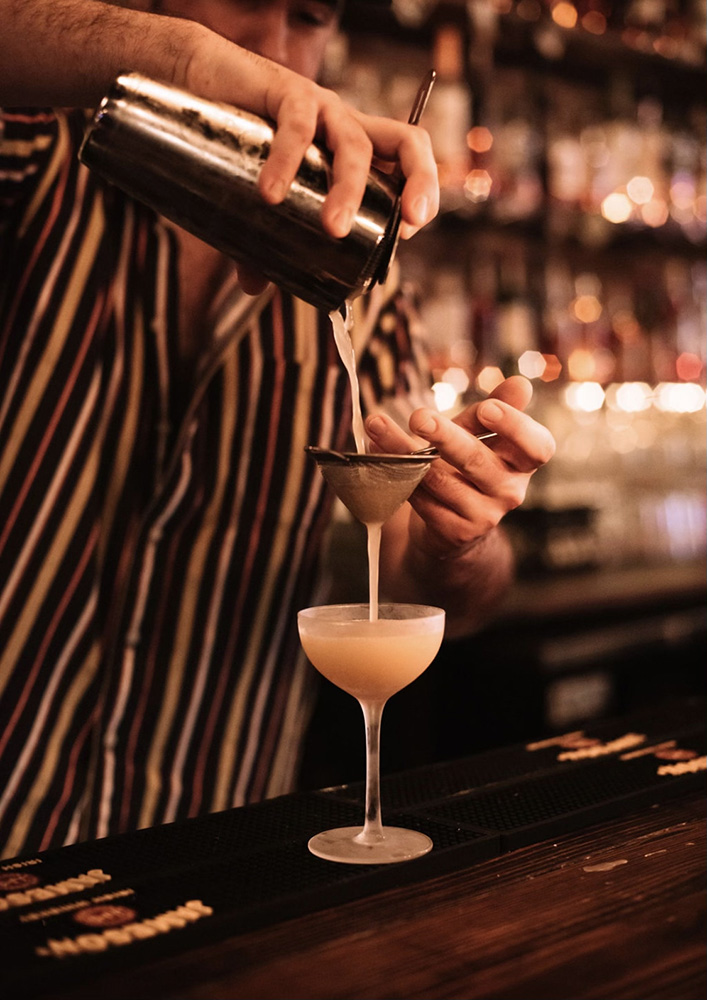 A bartender serving a drink
