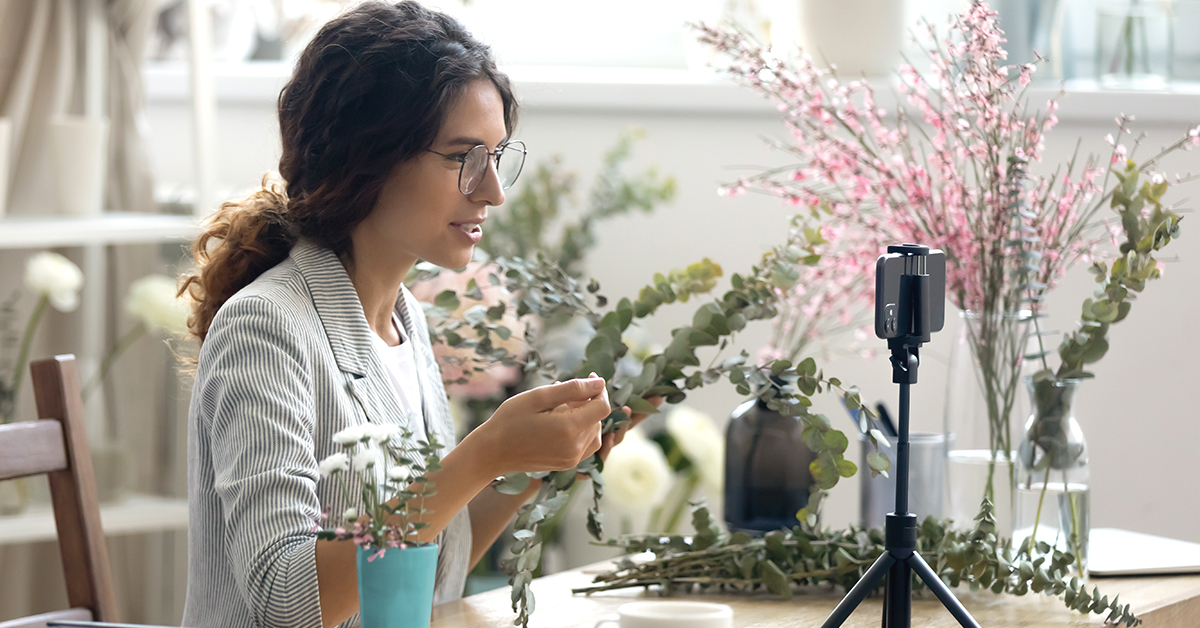 A woman filming a podcast