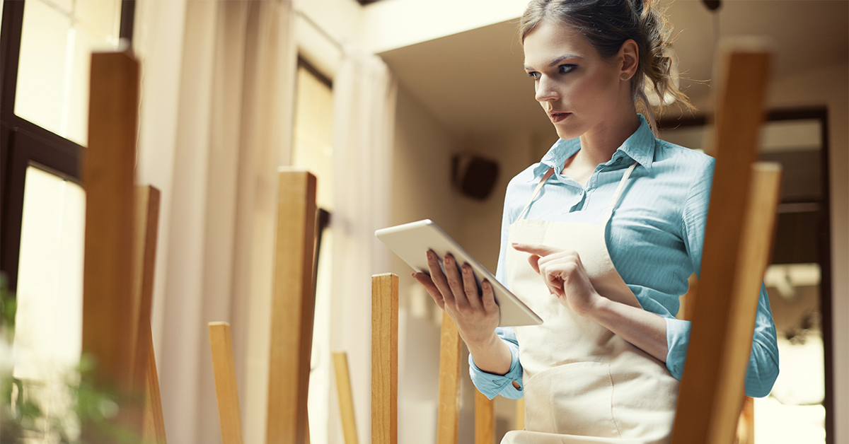 A woman looking at a tablet