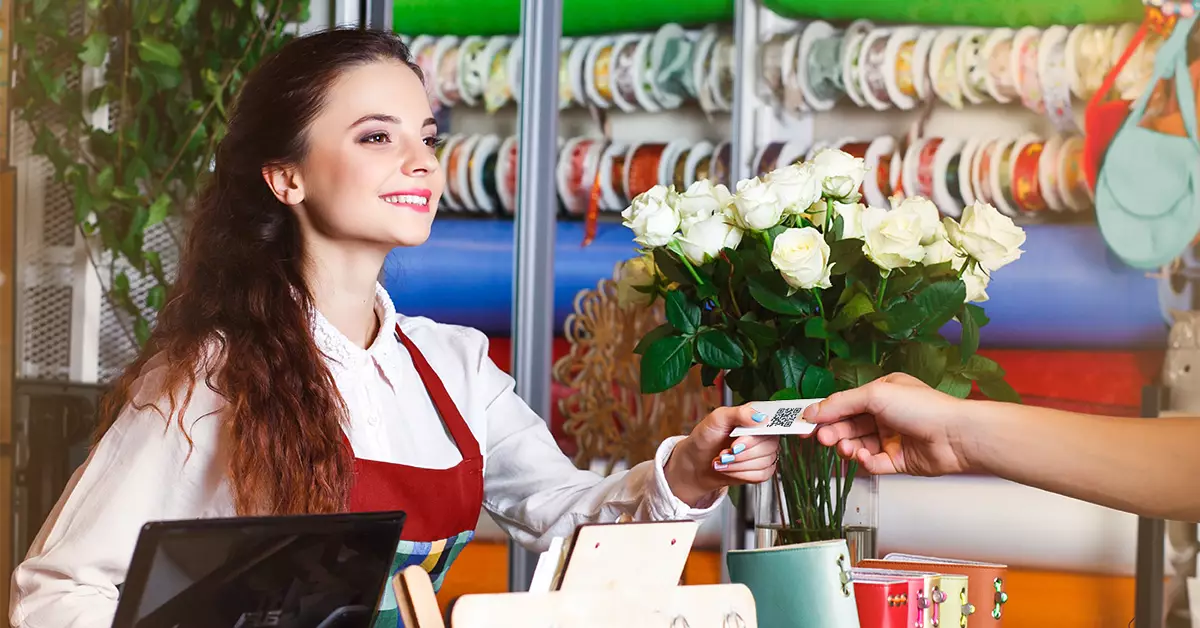 Florist taking payment at a register