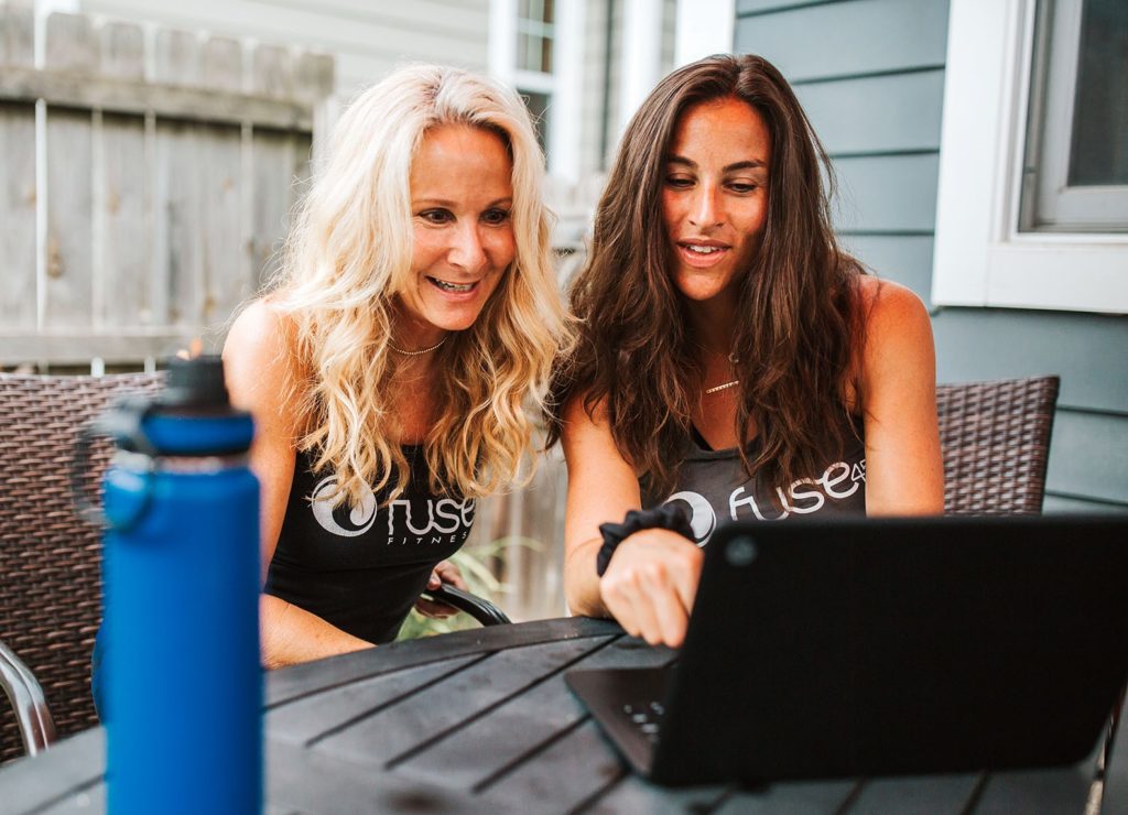 Two women looking at a computer