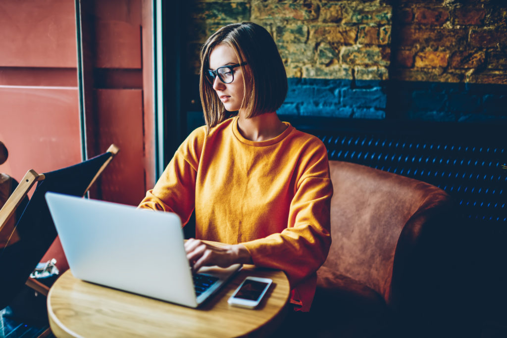 Woman typing on a computer