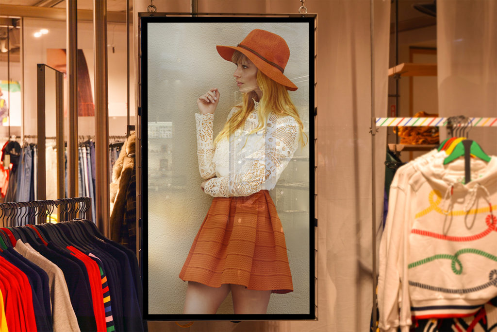 A advertisement photo of a woman in a clothing store