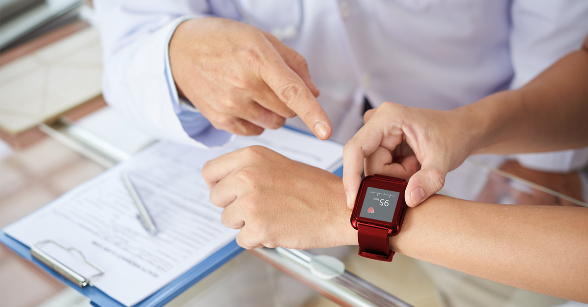 A doctor checking vitals on a smartwatch