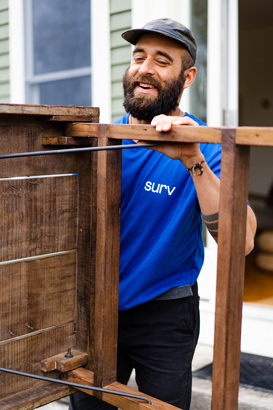 Man carrying a piece of furniture