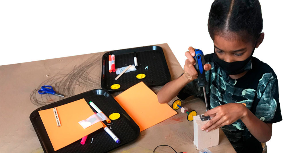 A child building a robot