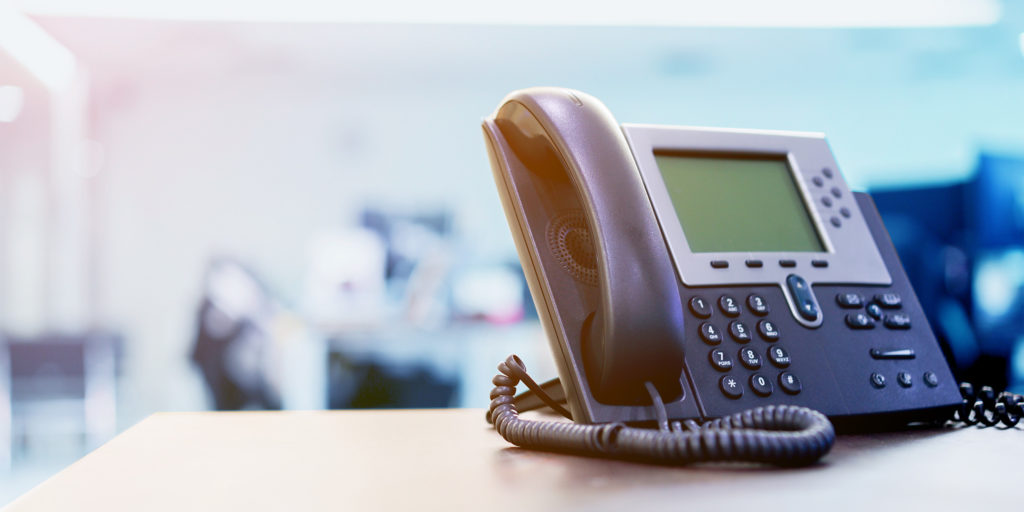 A phone sitting on a desk