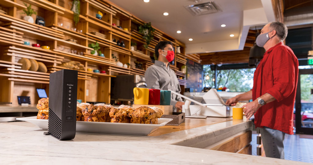 A person making a purchase at a coffee shop