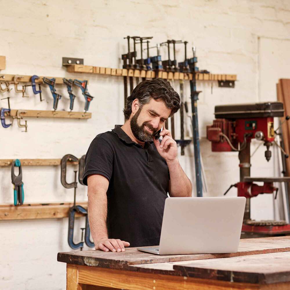 shop owner talking on the phone